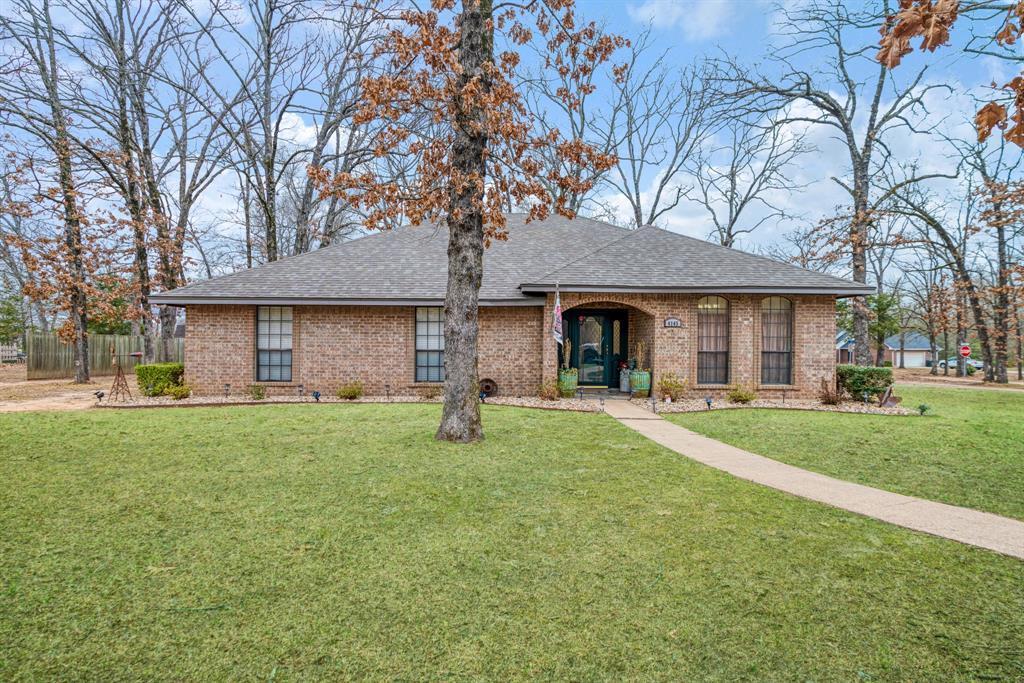 a front view of a house with a garden and porch