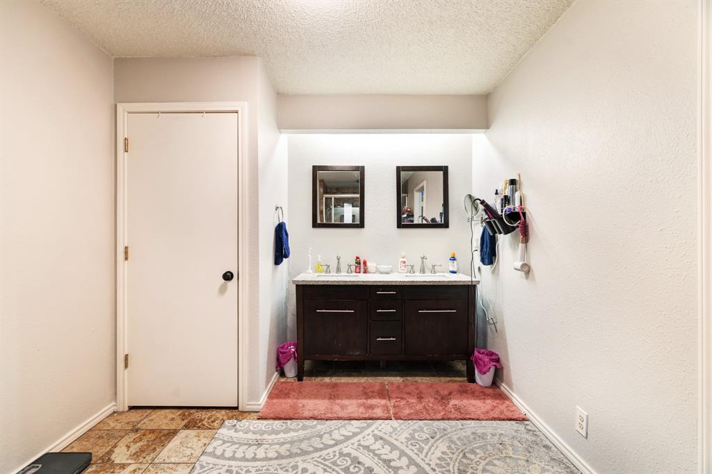 4145 Sleepy Hollow Reno, TX 75462 - Photo 13 of 20 a bathroom with a sink and a mirror