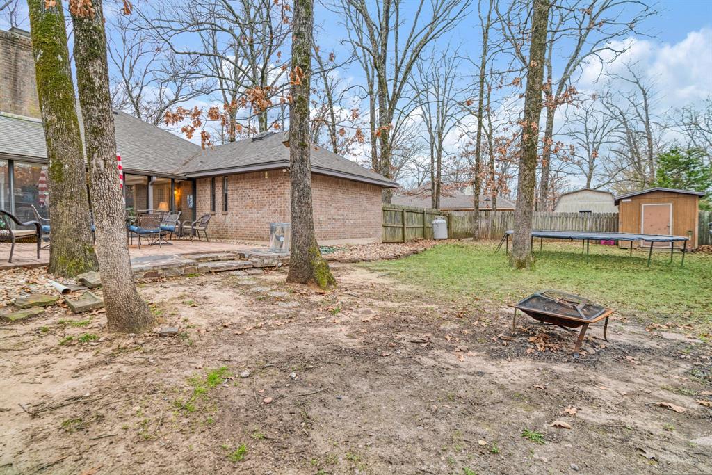 4145 Sleepy Hollow Reno, TX 75462 - Photo 19 of 20 a wooden bench sitting in front of a house