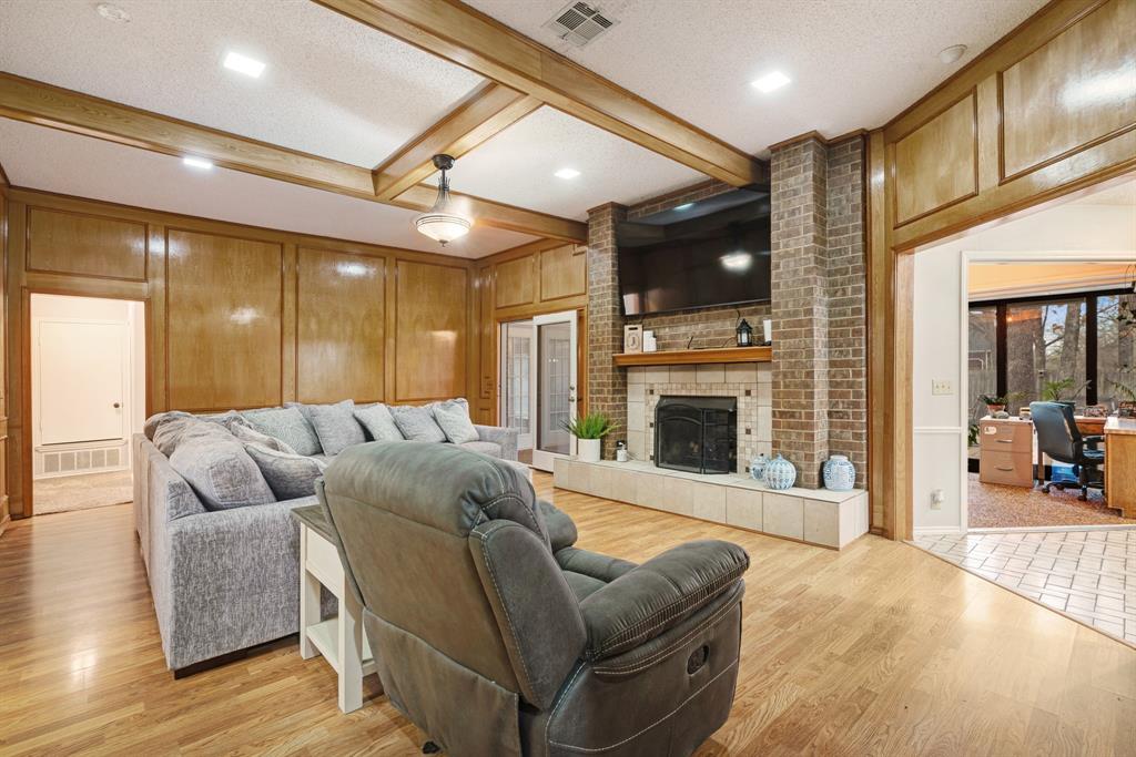 4145 Sleepy Hollow Reno, TX 75462 - Photo 4 of 20 a living room with furniture fireplace and a flat screen tv