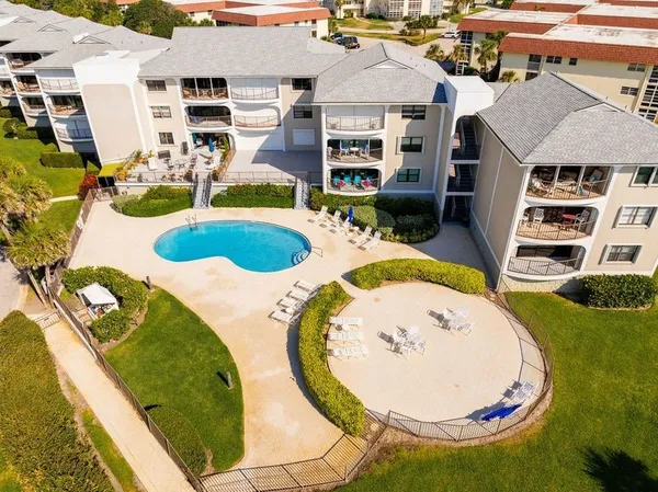 an aerial view of a house with swimming pool