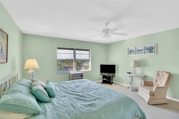 a bedroom with a bed and a tv
