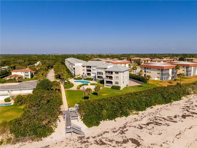 a view of a swimming pool with a yard