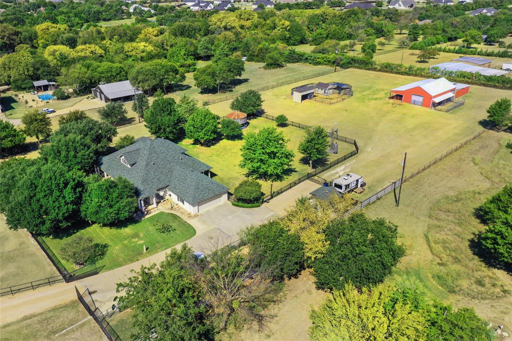 4451 Shiloh Road Midlothian, TX 76065 - Photo 36 of 39 This aerial view is the back portion of the property. This is approximately two thirds of the actual size. You can see the side load garage, dog house, gazebo, barn, and chicken coop.