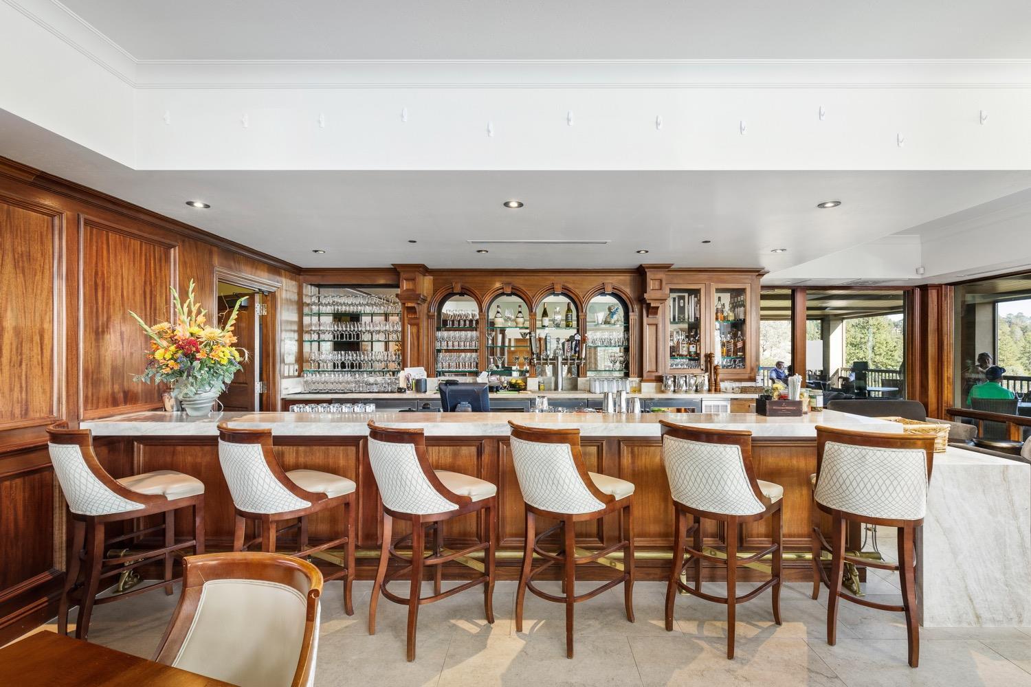1575 Ridgemore Drive Meadow Vista, CA 95722 - Photo 17 of 30 a dining hall with stainless steel appliances a dining table and chairs with the floor to ceiling window