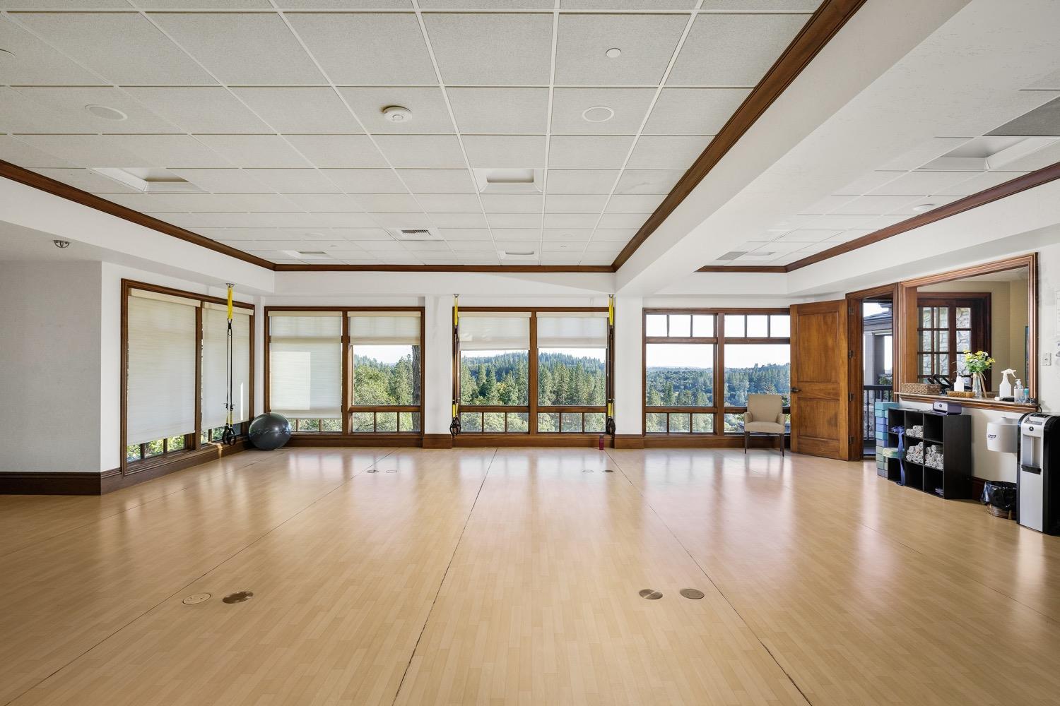 1575 Ridgemore Drive Meadow Vista, CA 95722 - Photo 23 of 30 a view of an empty room with wooden floor and a window