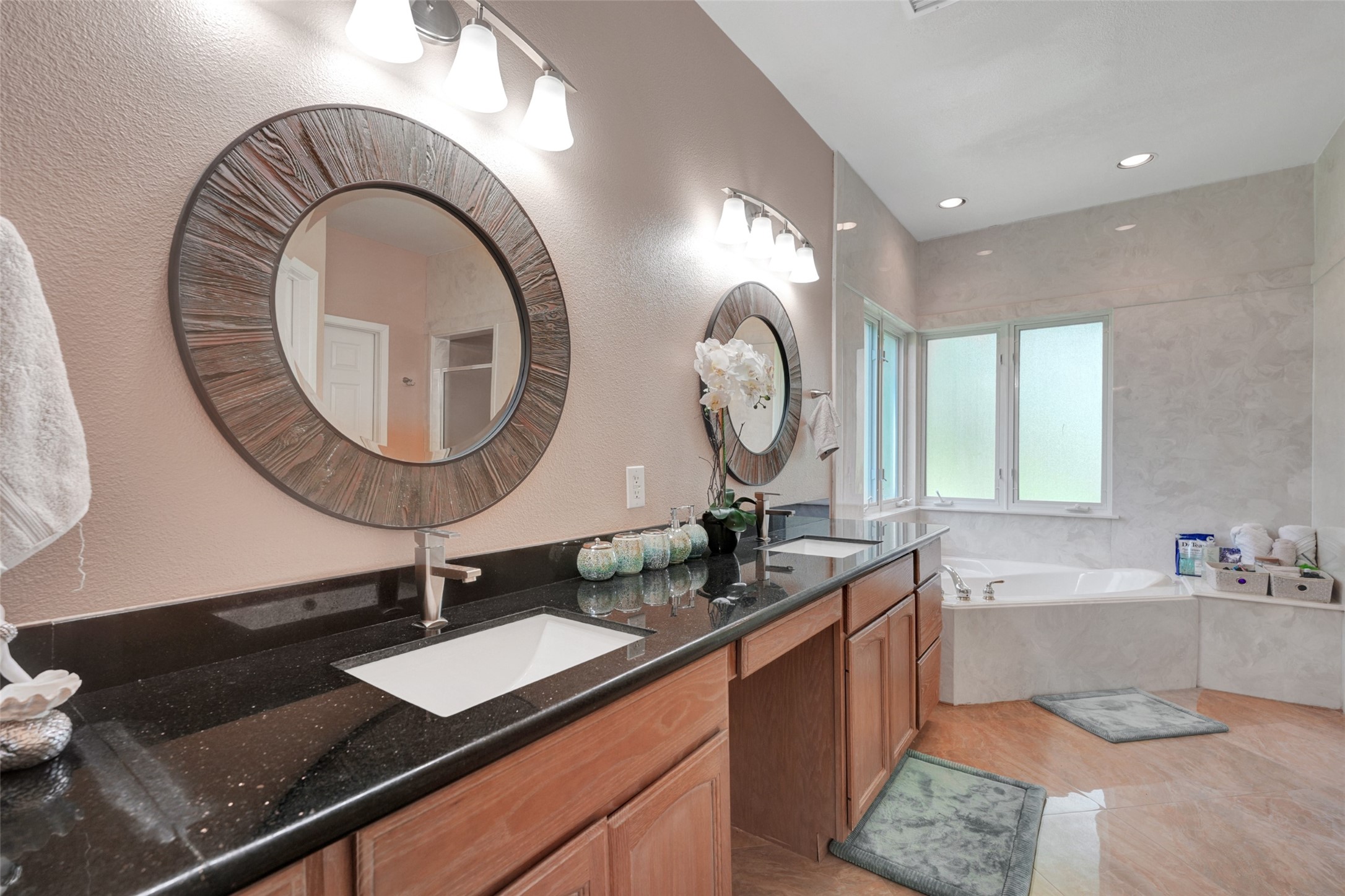 2750 County Road 48 Rosharon, TX 77583 - Photo 12 of 17 a bathroom with a granite countertop sink and a mirror
