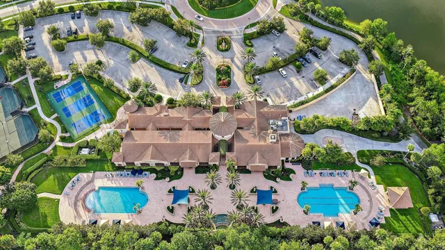 an aerial view of residential building and lake