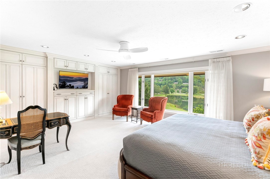 361 The Lakes, Unit C9 Boone, NC 28607 - Photo 22 of 47 a bedroom with a bed and large windows