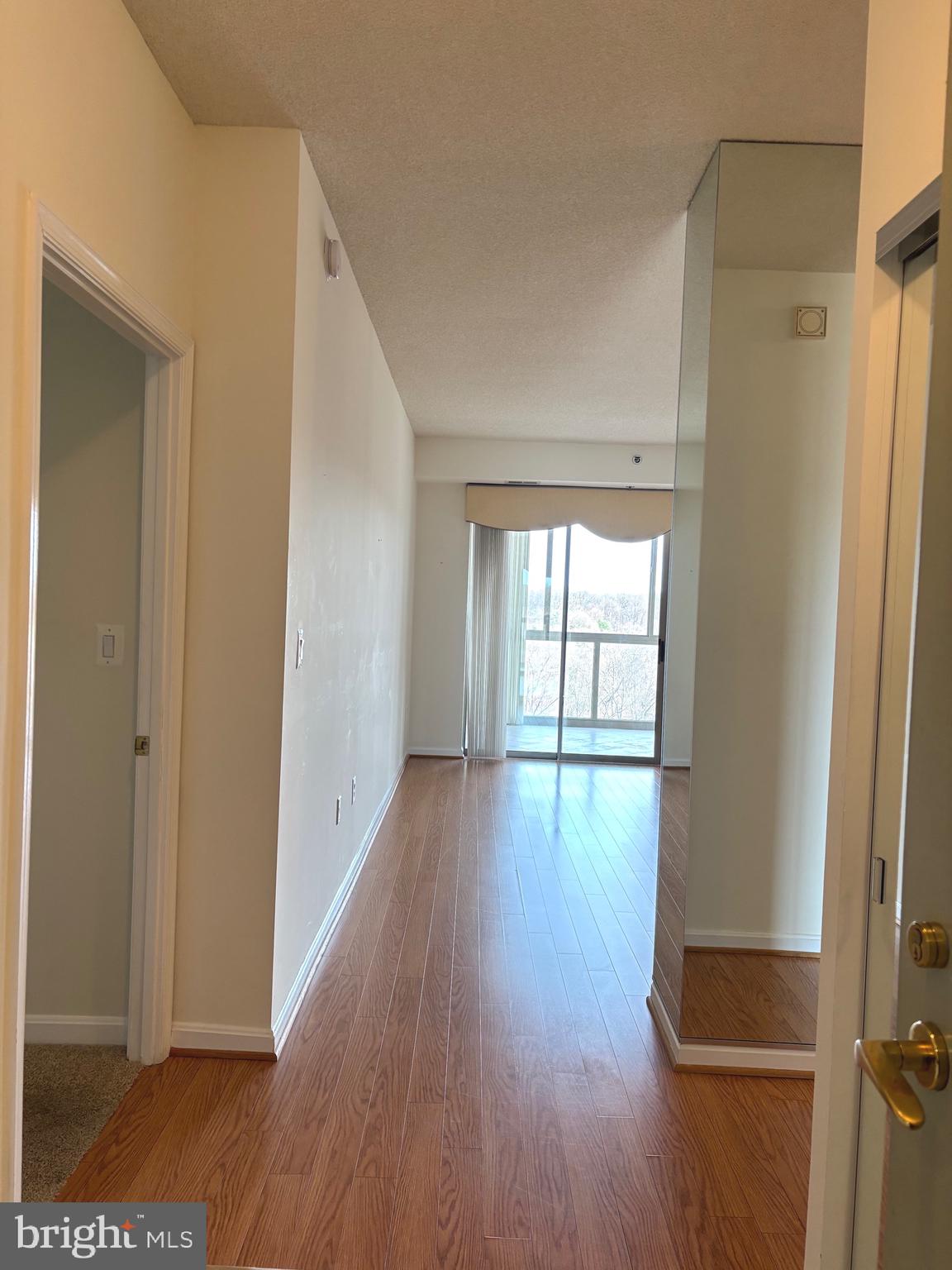 3200 North Leisure World Boulevard, Unit 911 Silver Spring, MD 20906 - Photo 15 of 39 a view of empty room with wooden floor and fan