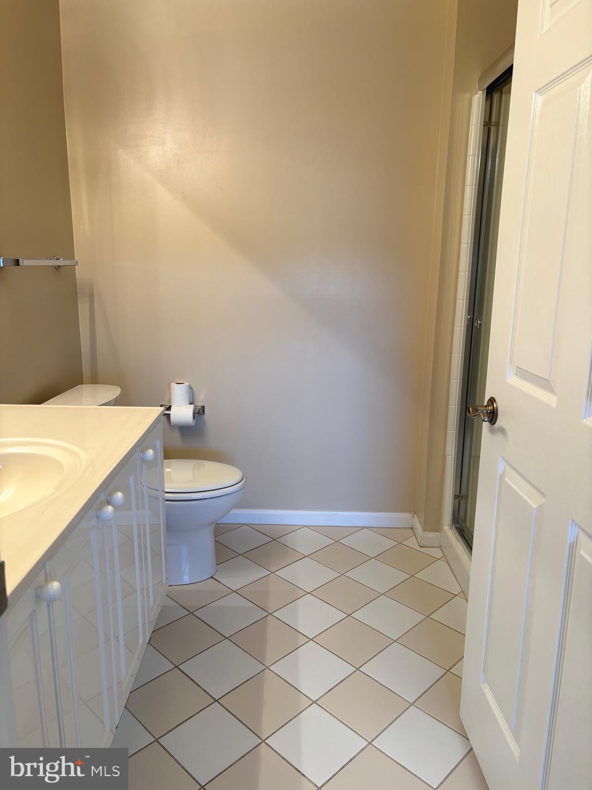 3200 North Leisure World Boulevard, Unit 911 Silver Spring, MD 20906 - Photo 23 of 39 a bathroom with a sink and a mirror