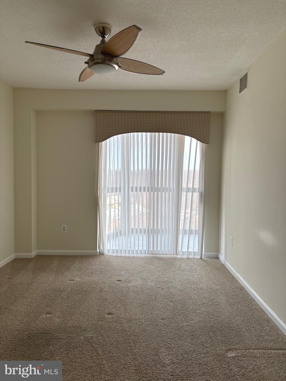 3200 North Leisure World Boulevard, Unit 911 Silver Spring, MD 20906 - Photo 24 of 39 a view of an empty room with a window