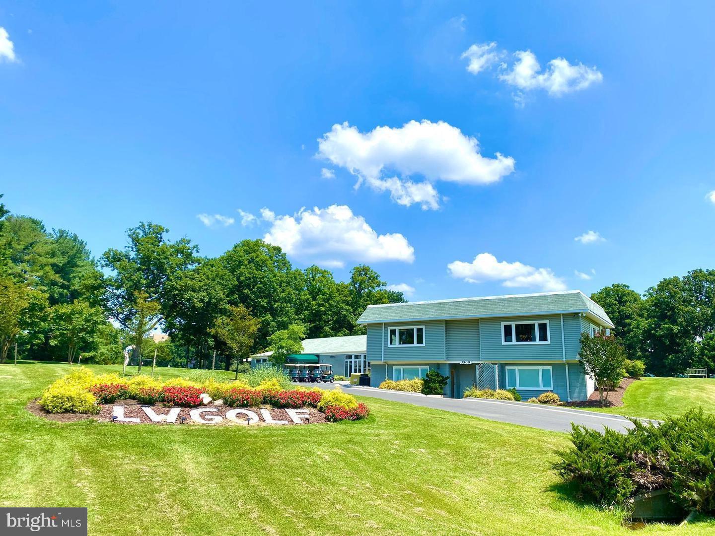 3200 North Leisure World Boulevard, Unit 911 Silver Spring, MD 20906 - Photo 33 of 39 a view of a house with swimming pool yard and green space