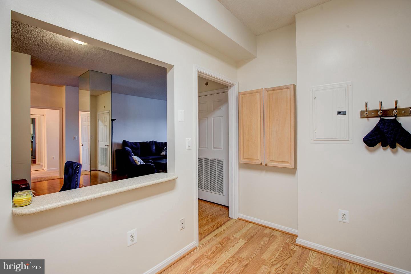 3200 North Leisure World Boulevard, Unit 911 Silver Spring, MD 20906 - Photo 7 of 39 a view of a room with wooden floor and staircase
