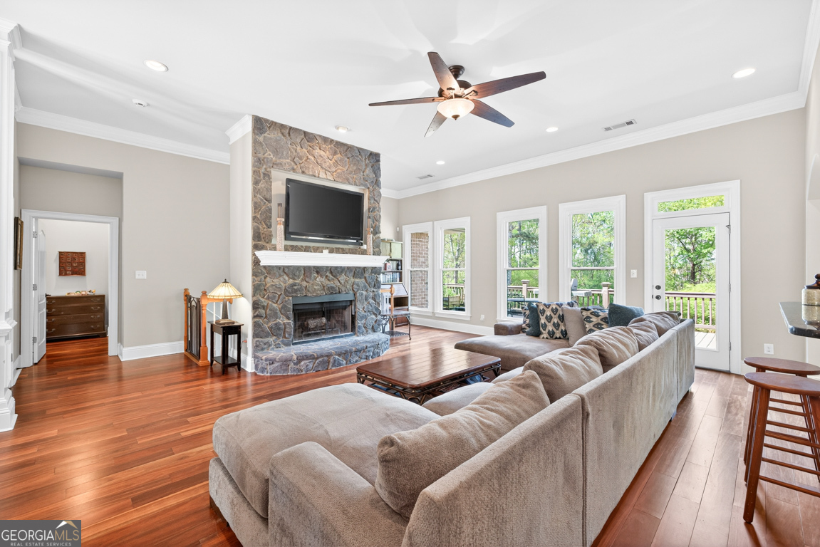 1121 Deer Trail Bishop, GA 30621 - Photo 14 of 98 a living room with furniture a flat screen tv and a fireplace