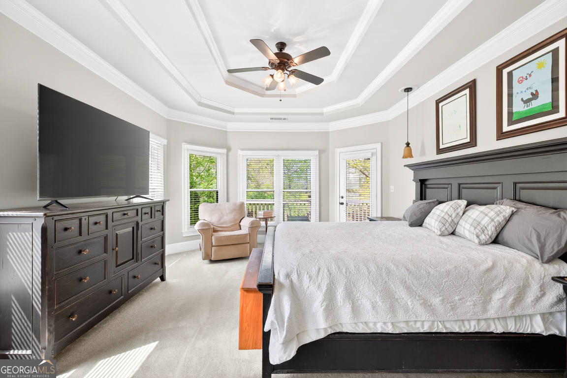 1121 Deer Trail Bishop, GA 30621 - Photo 24 of 98 a bedroom with a bed and a flat screen tv
