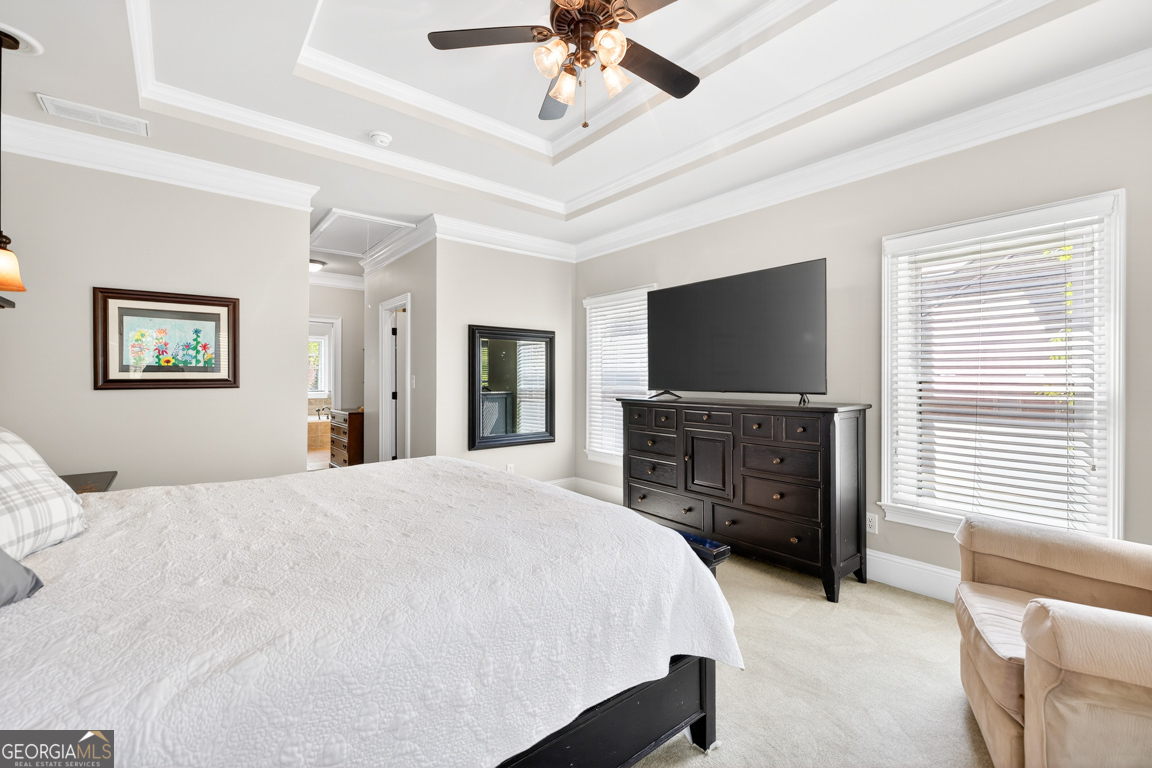 1121 Deer Trail Bishop, GA 30621 - Photo 27 of 98 a bedroom with a bed and a flat screen tv