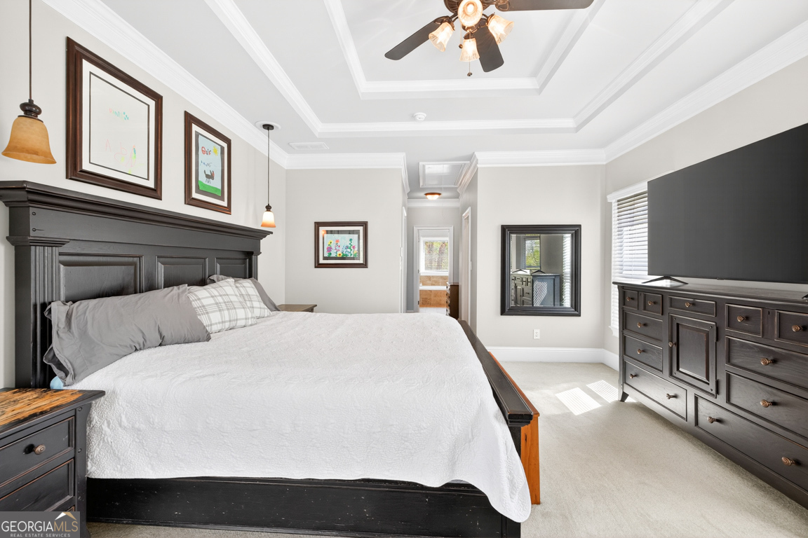 1121 Deer Trail Bishop, GA 30621 - Photo 29 of 98 a bedroom with a large bed and a flat screen tv