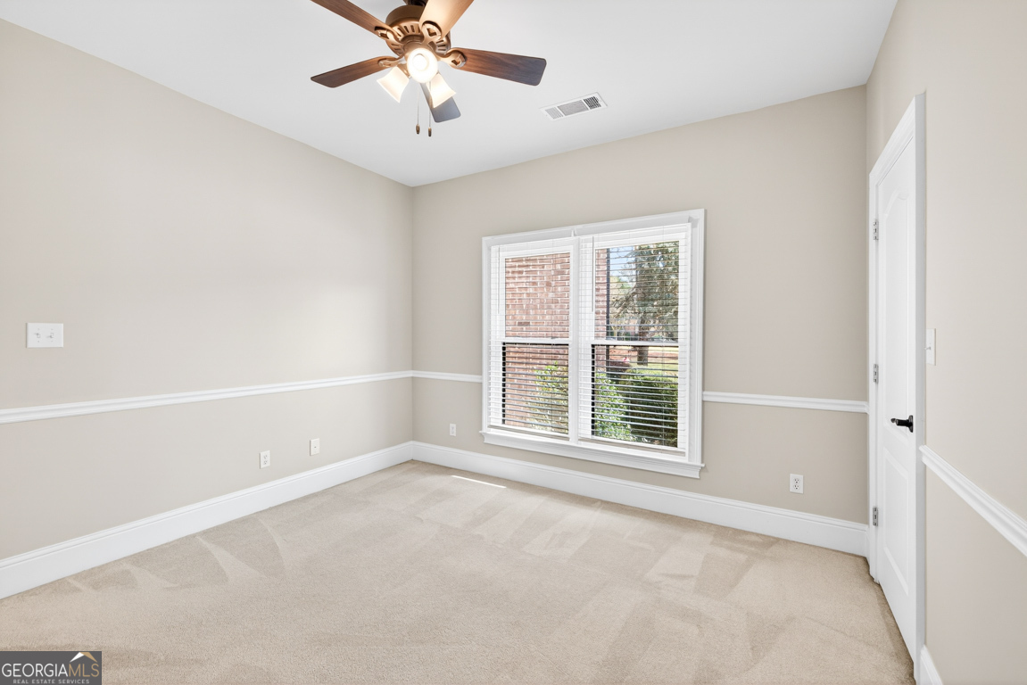 1121 Deer Trail Bishop, GA 30621 - Photo 36 of 98 an empty room with windows and fan