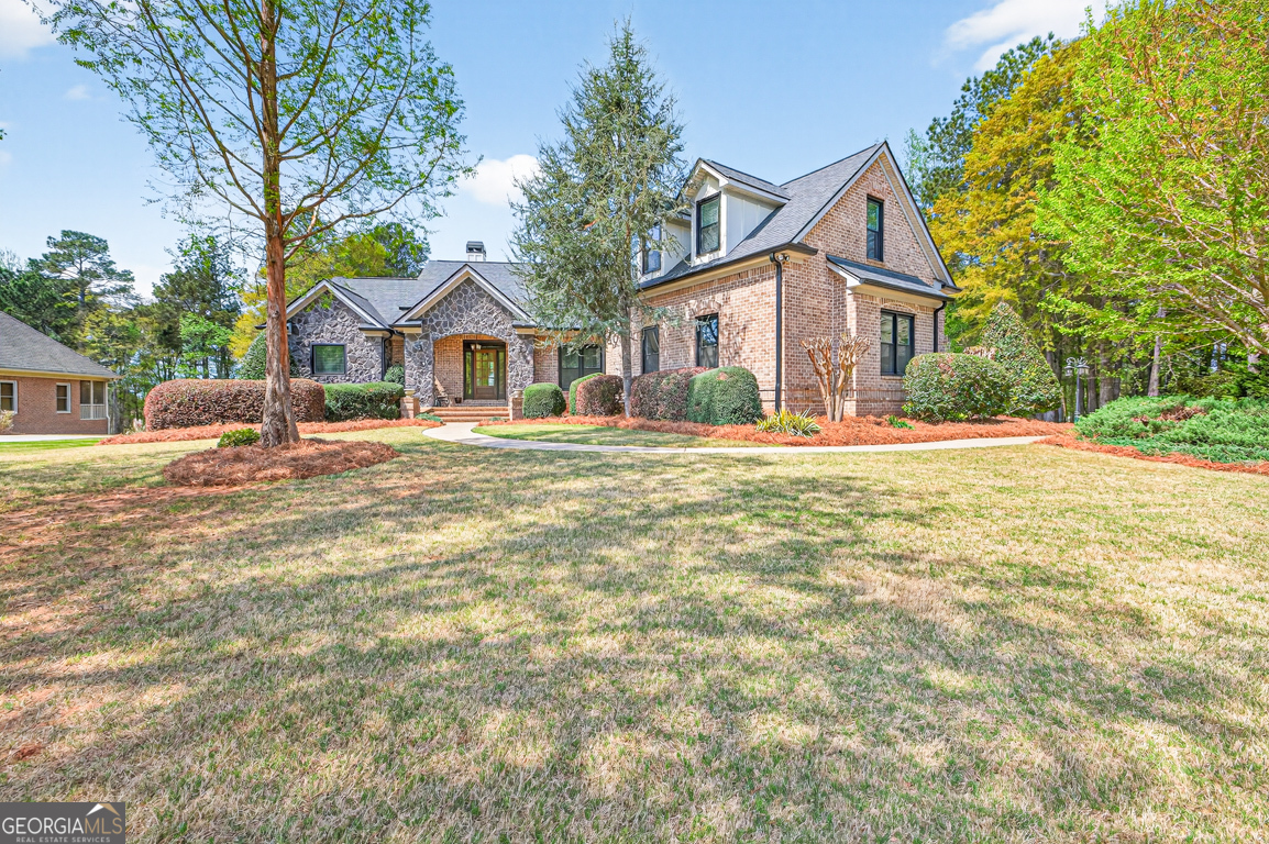 1121 Deer Trail Bishop, GA 30621 - Photo 4 of 98 a front view of a house with a yard