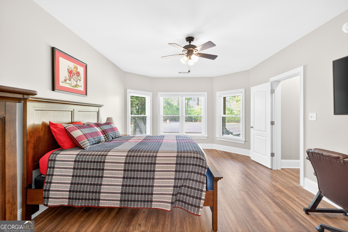 1121 Deer Trail Bishop, GA 30621 - Photo 54 of 98 a bedroom with a large bed and a window