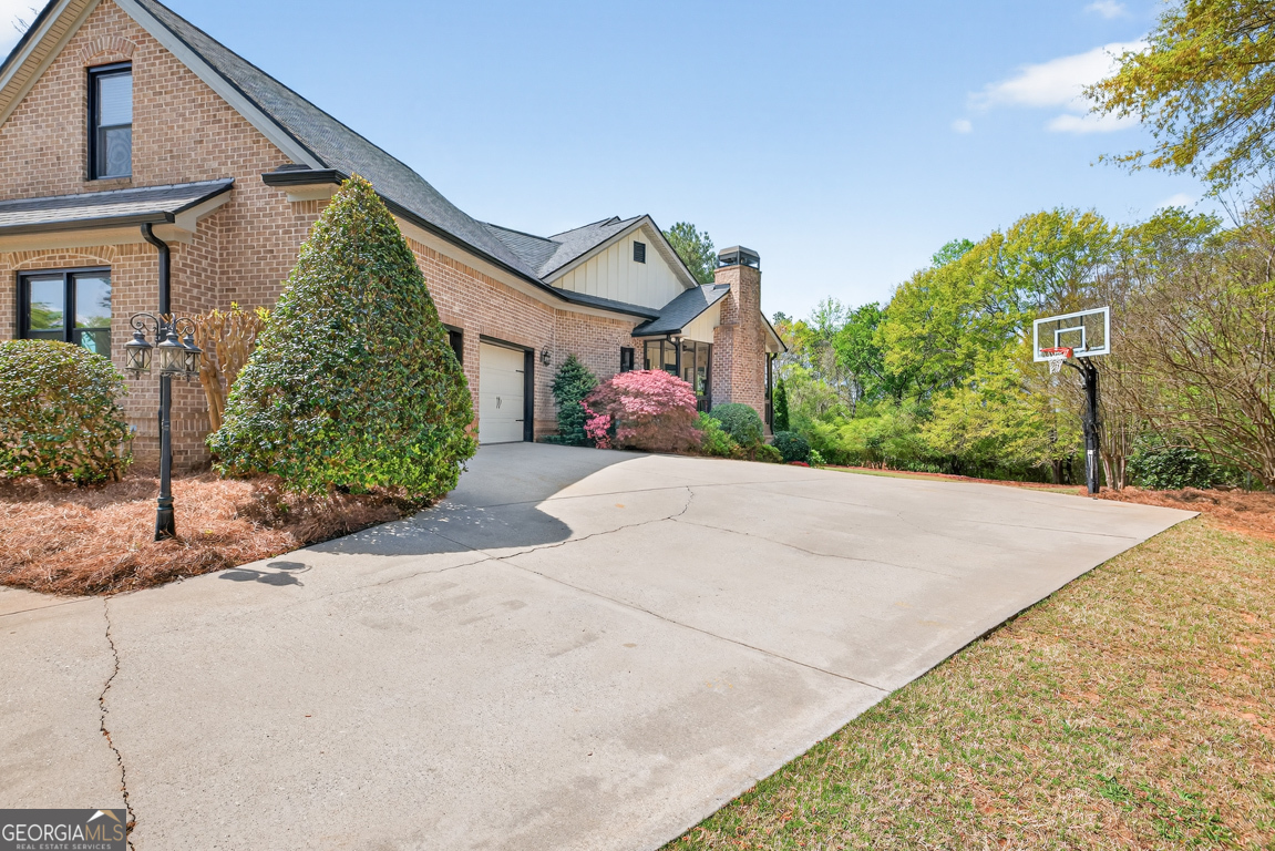 1121 Deer Trail Bishop, GA 30621 - Photo 7 of 98 a front view of a house with a yard and garage