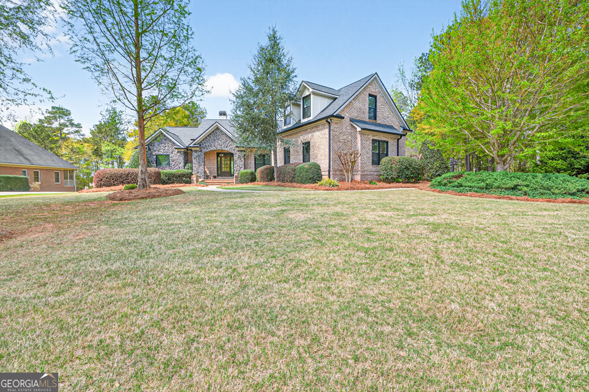 1121 Deer Trail Bishop, GA 30621 - Photo 72 of 98 a front view of house with yard and trees around