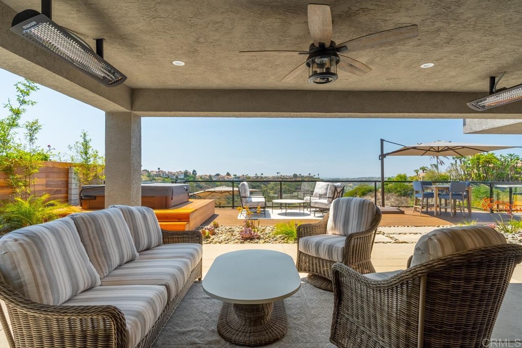 1784 Hawk View Drive Encinitas, CA 92024 - Photo 24 of 71 a living room with furniture and a floor to ceiling window