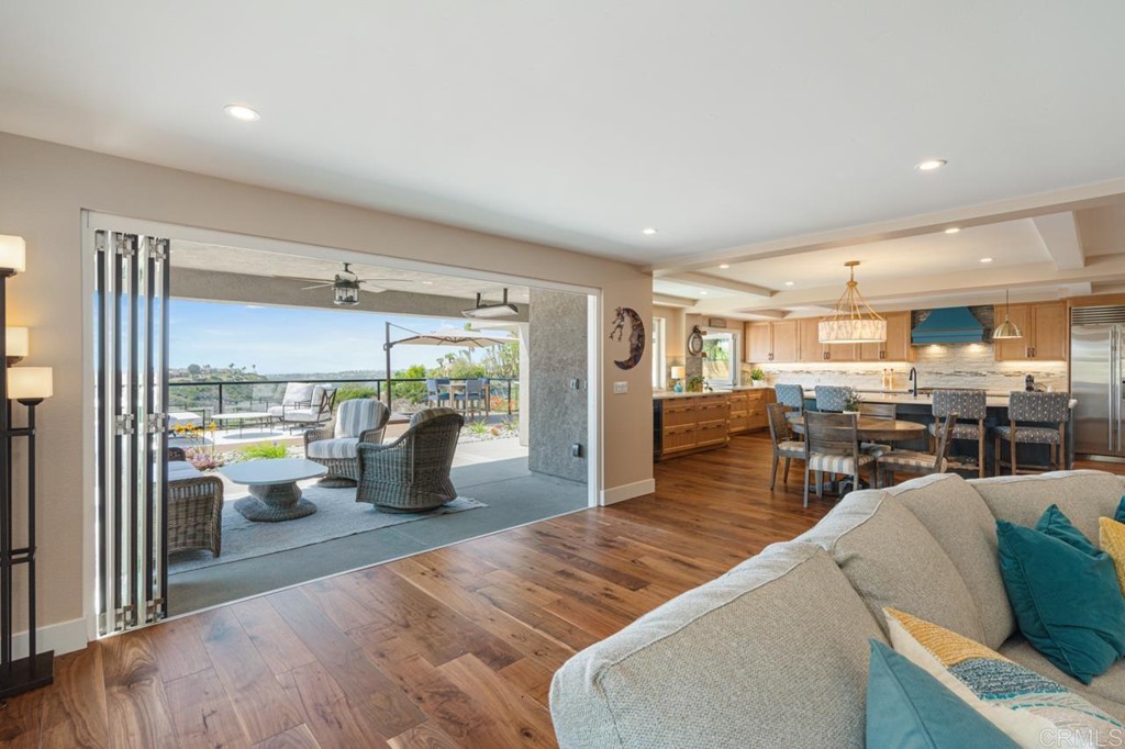 1784 Hawk View Drive Encinitas, CA 92024 - Photo 25 of 71 a living room with furniture and a wooden floor