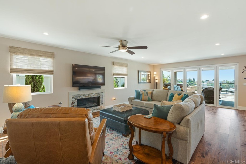 1784 Hawk View Drive Encinitas, CA 92024 - Photo 27 of 71 a living room with furniture and a flat screen tv