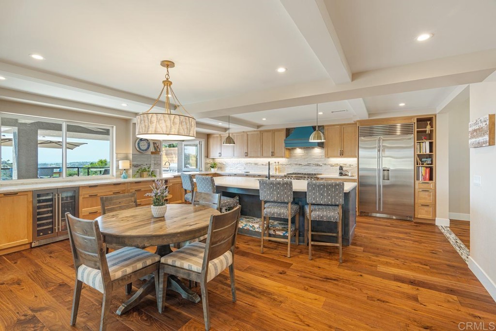 1784 Hawk View Drive Encinitas, CA 92024 - Photo 30 of 71 a dining room with furniture a chandelier and wooden floor