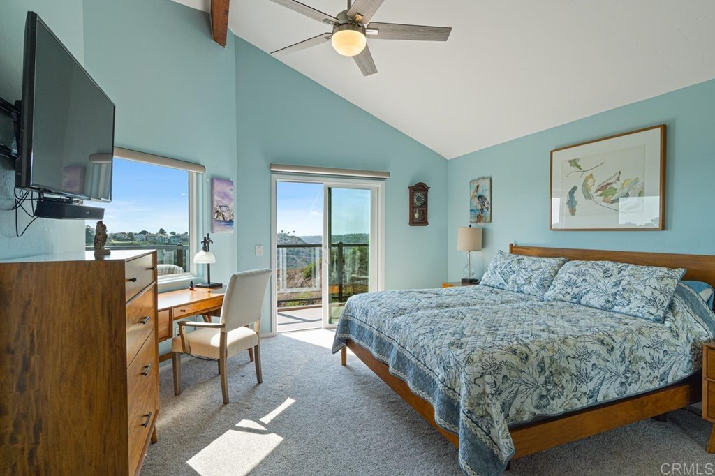 1784 Hawk View Drive Encinitas, CA 92024 - Photo 54 of 71 a bedroom with a bed window and a flat screen tv