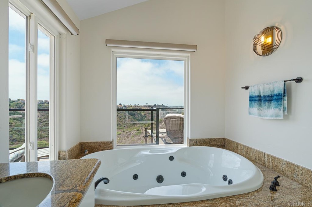 1784 Hawk View Drive Encinitas, CA 92024 - Photo 56 of 71 a bathroom with a tub and a large window