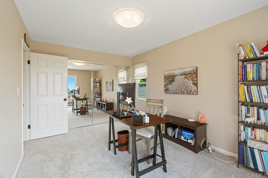 1784 Hawk View Drive Encinitas, CA 92024 - Photo 60 of 71 a view of a livingroom with furniture and a bookshelf