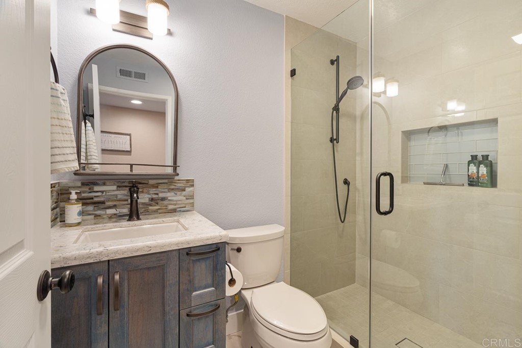 1784 Hawk View Drive Encinitas, CA 92024 - Photo 67 of 71 a bathroom with a sink a toilet and shower