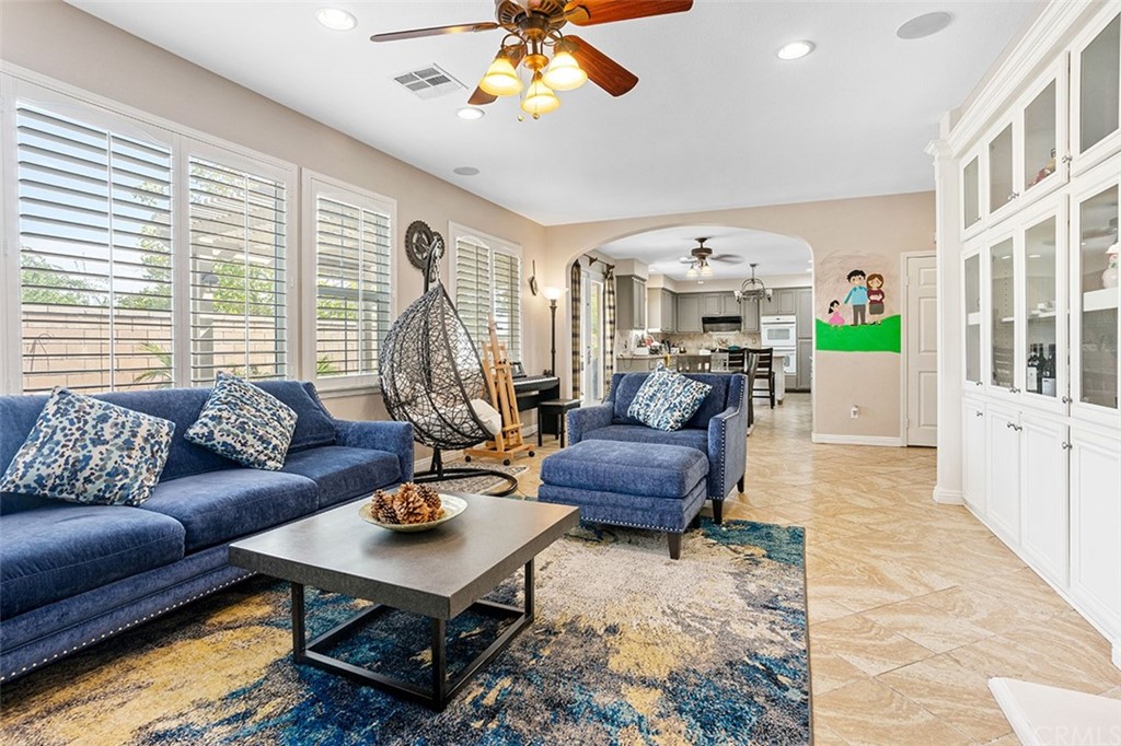 12547 Vintner Drive Rancho Cucamonga, CA 91739 - Photo 14 of 52 a living room with furniture and a chandelier