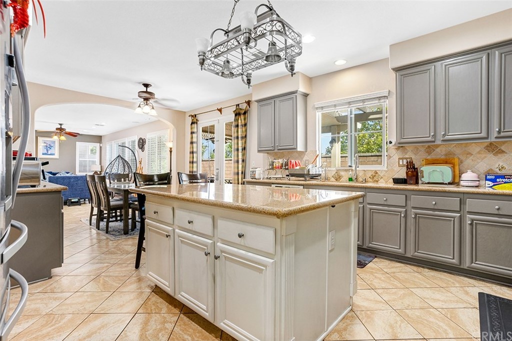 12547 Vintner Drive Rancho Cucamonga, CA 91739 - Photo 19 of 52 a kitchen with cabinets and window