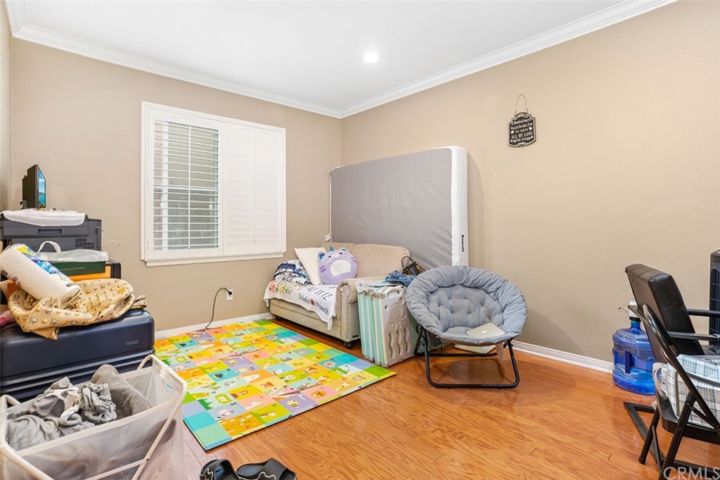 12547 Vintner Drive Rancho Cucamonga, CA 91739 - Photo 25 of 52 a bedroom with furniture and a window