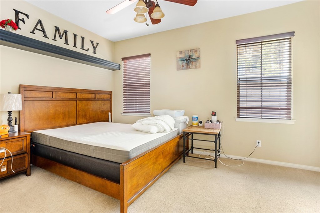 12547 Vintner Drive Rancho Cucamonga, CA 91739 - Photo 26 of 52 a bed sitting in a bedroom next to a window