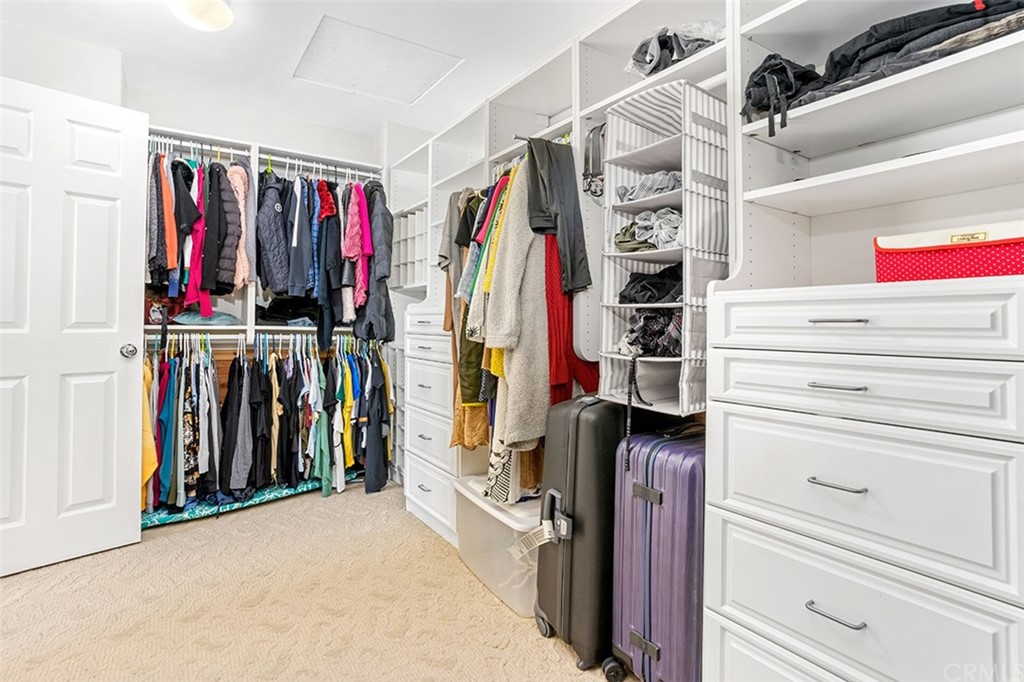 12547 Vintner Drive Rancho Cucamonga, CA 91739 - Photo 34 of 52 a view of walk in closet with clothes