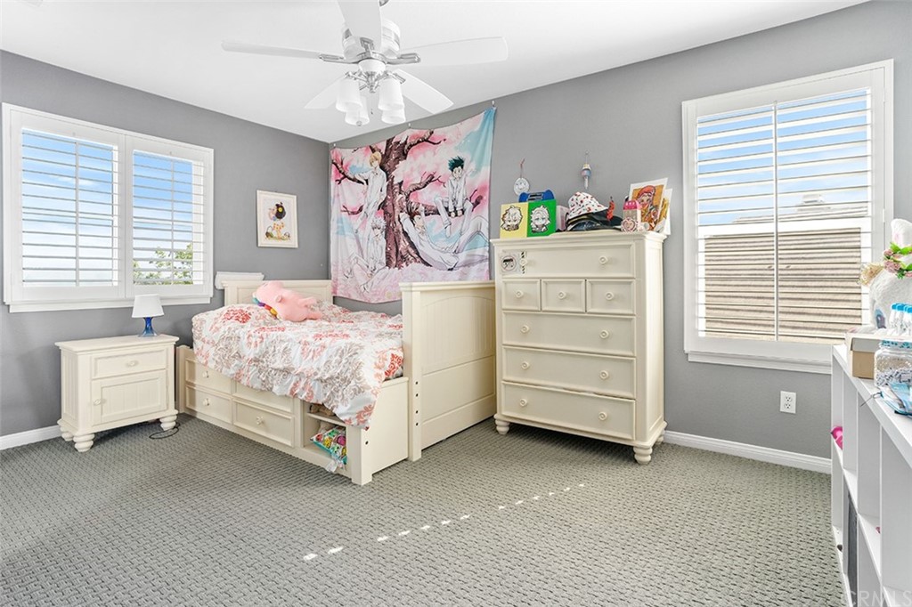 12547 Vintner Drive Rancho Cucamonga, CA 91739 - Photo 37 of 52 a bedroom with a bed and a window