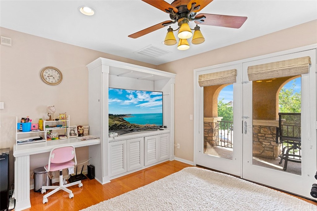 12547 Vintner Drive Rancho Cucamonga, CA 91739 - Photo 40 of 52 a living room with furniture and a flat screen tv