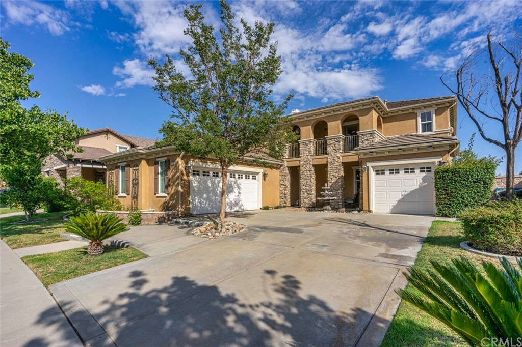 12547 Vintner Drive Rancho Cucamonga, CA 91739 - Photo 4 of 52 a front view of a house with a yard