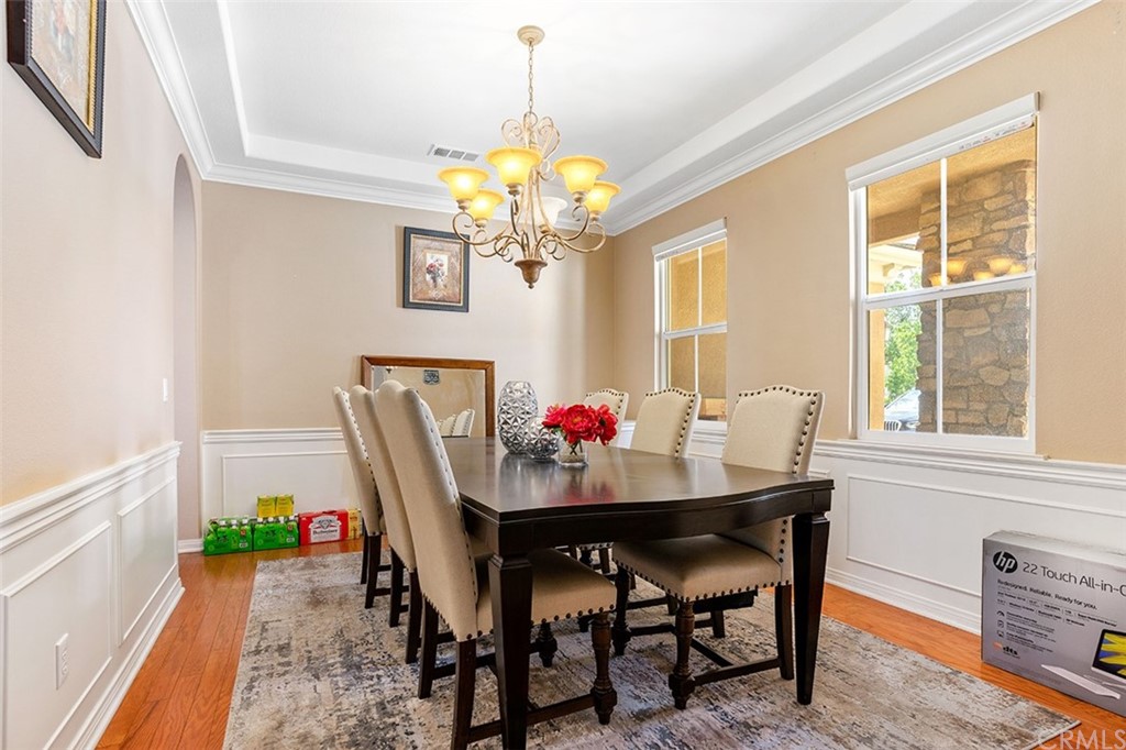 12547 Vintner Drive Rancho Cucamonga, CA 91739 - Photo 6 of 52 a dining room with furniture a livingroom and wooden floor