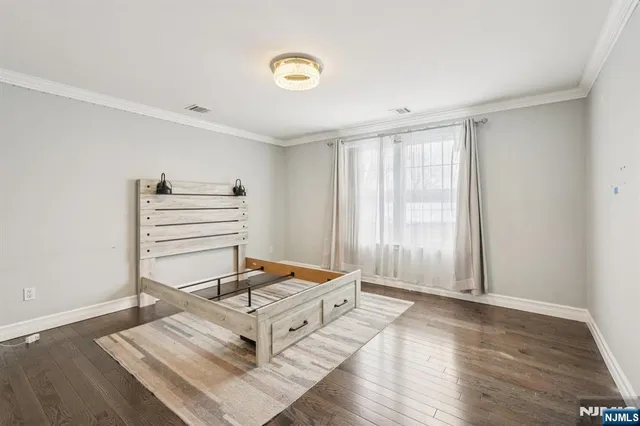 a room with a window and wooden floor