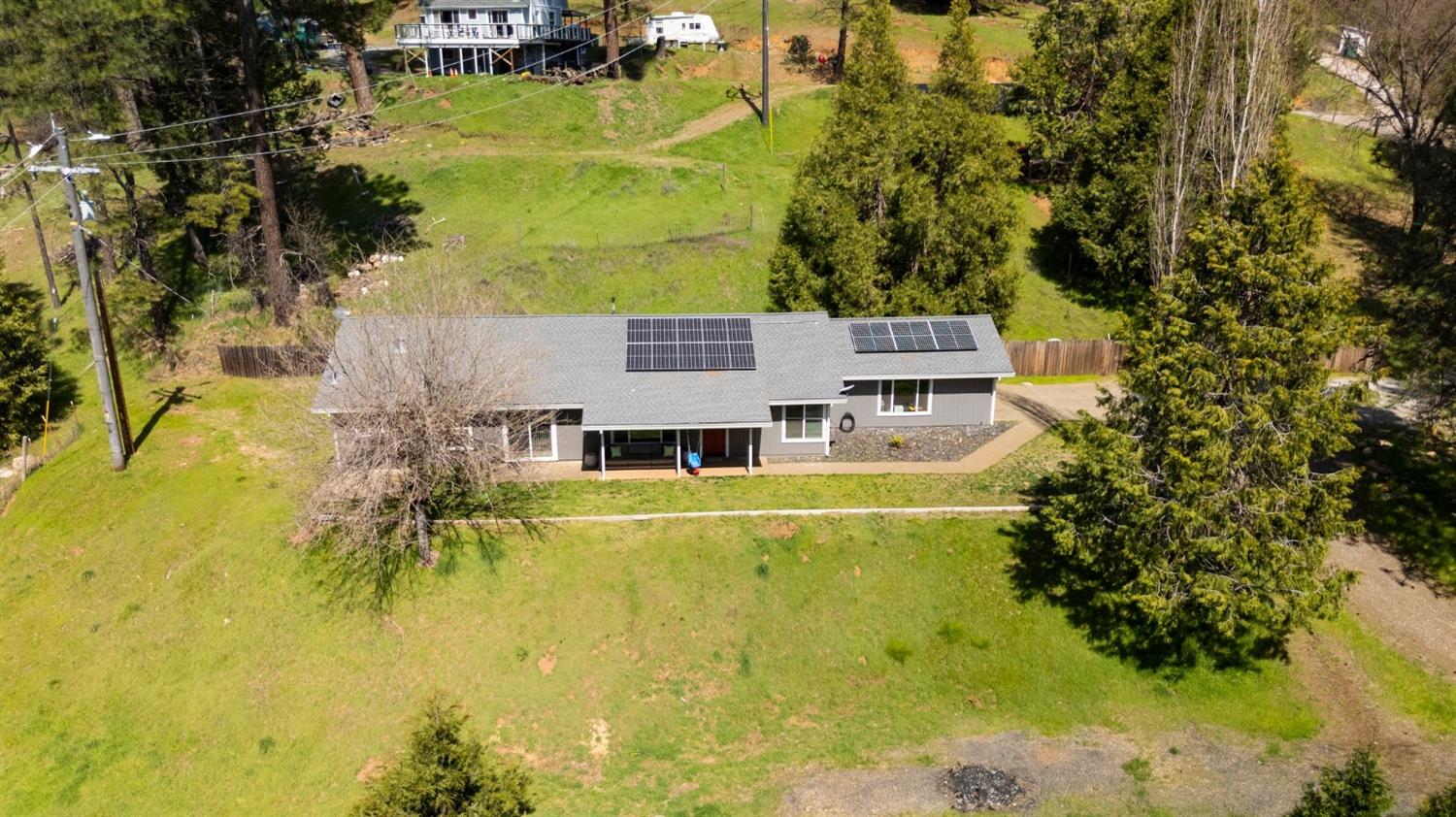 4842 Northern Lights Road Placerville, CA 95667 - Photo 2 of 26 a view of a swimming pool with a yard