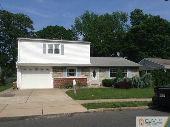 25 Cambridge Road Edison, NJ 08817 - Photo 1 of 13 a front view of a house with a garden