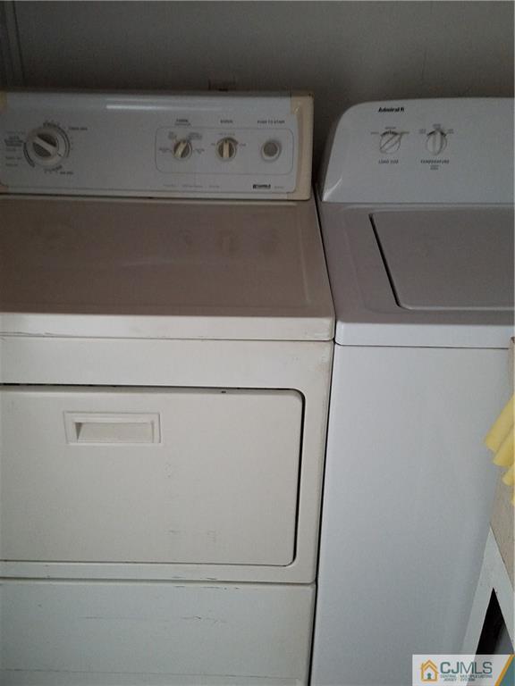 25 Cambridge Road Edison, NJ 08817 - Photo 12 of 13 a utility room with dryer and washer