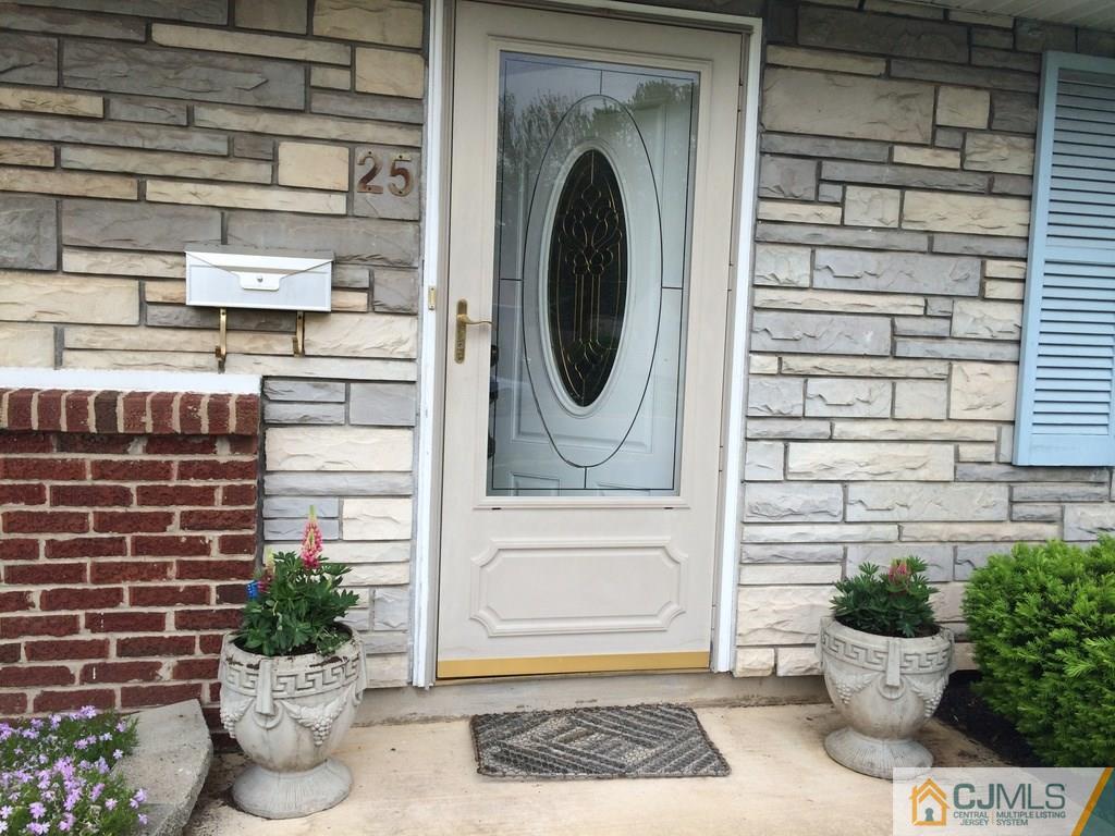 25 Cambridge Road Edison, NJ 08817 - Photo 8 of 13 a view of entryway with a potted plant