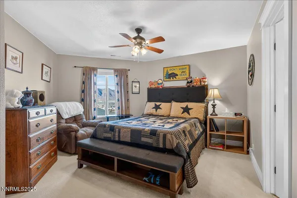 a living room with furniture and floor to ceiling window
